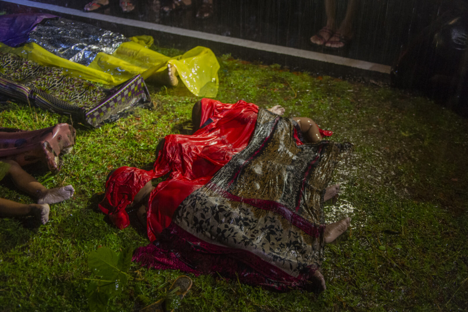 A row of lifeless bodies of Rohingya children